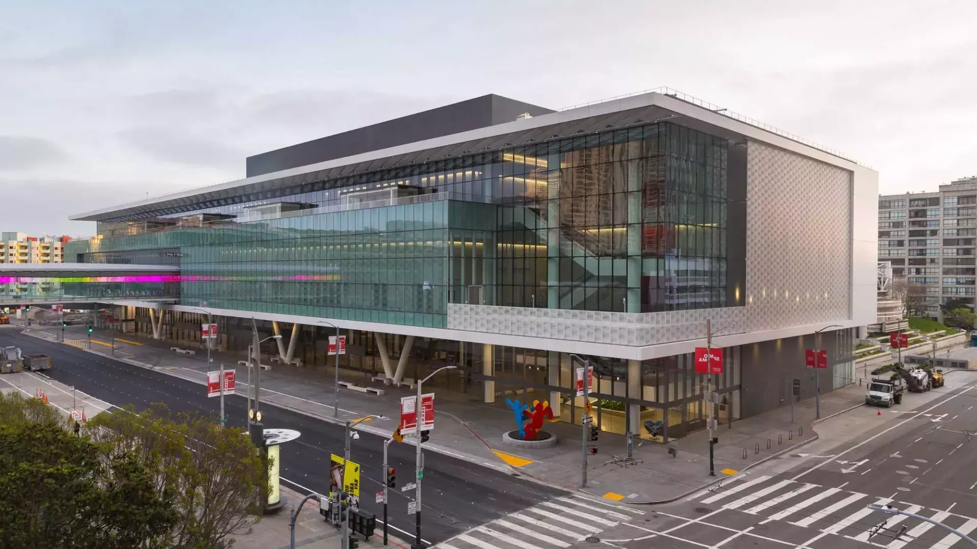 A wide shot of the glassy, modern Moscone Center South building.